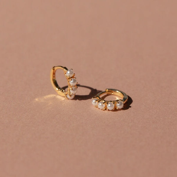 Elegant Pearl Huggers Earrings with 14kt gold overlay and snug huggie design.