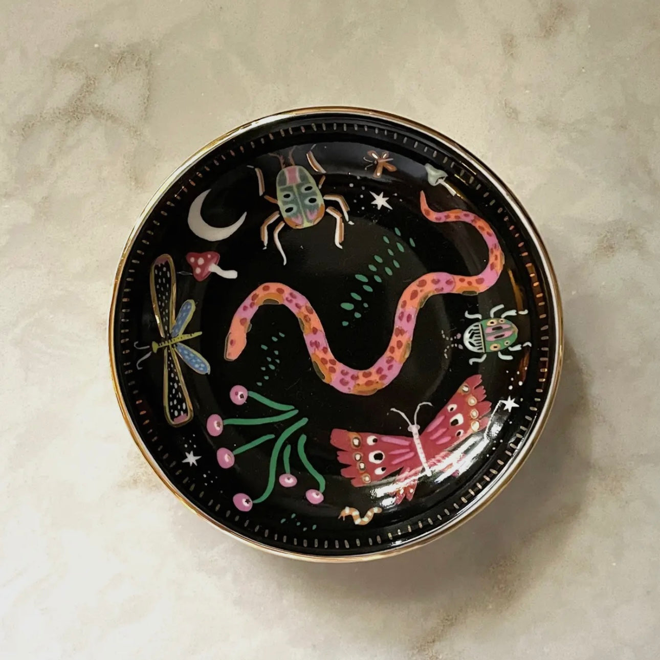 White ceramic Midnight Garden Trinket Dish with colorful hand-painted designs and gold edges