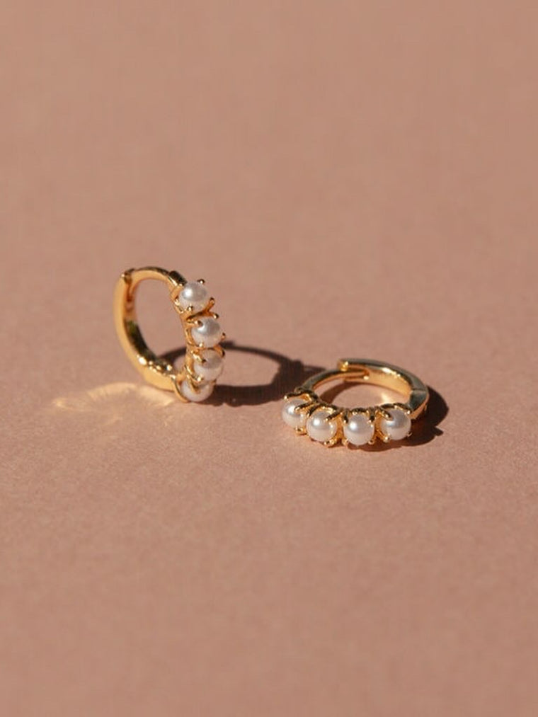 Elegant Pearl Huggers Earrings with 14kt gold overlay and snug huggie design.