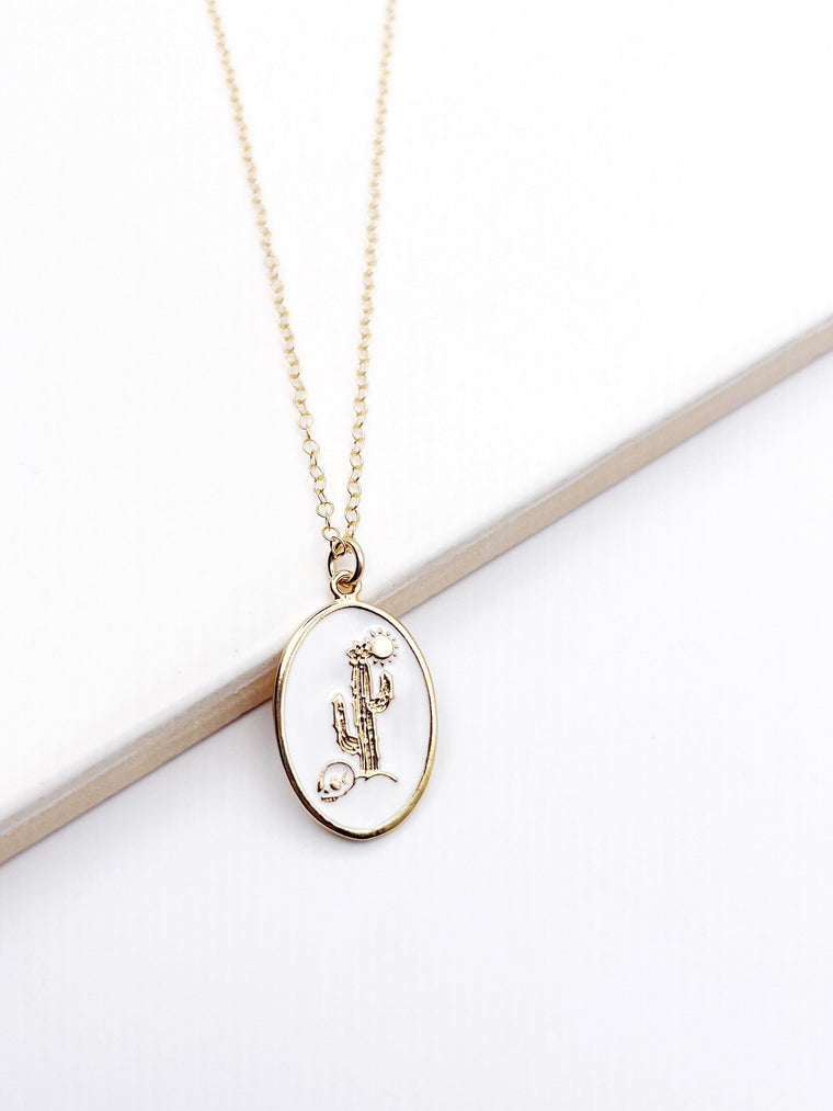White enameled cactus necklace with a glossy finish on a delicate chain.